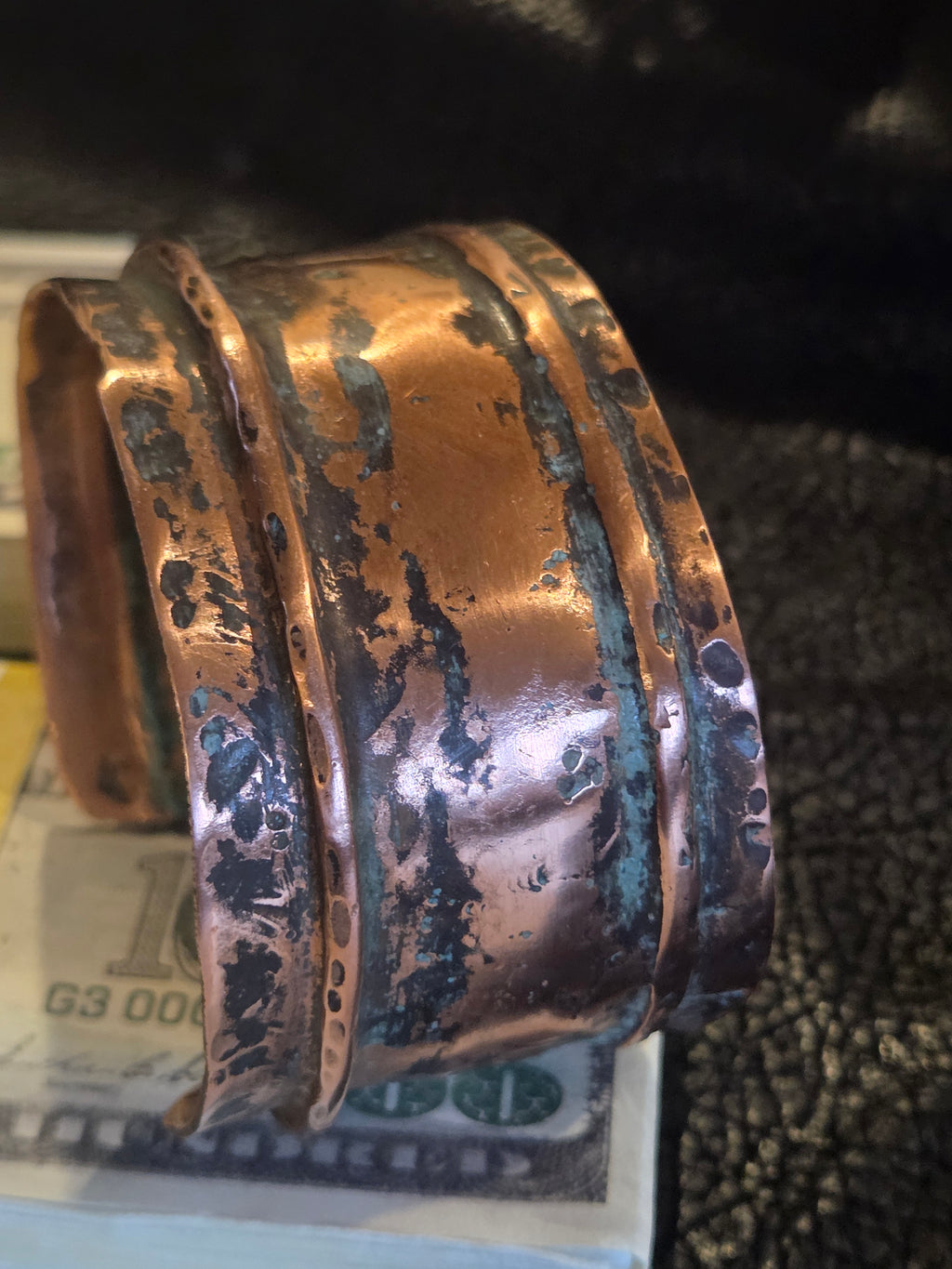 Bronze or copper ring on a textured surface